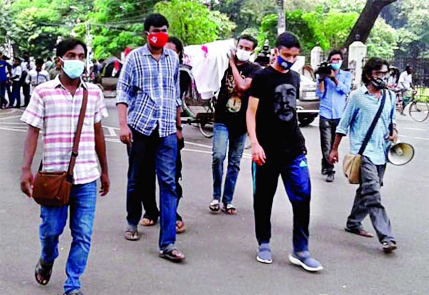 Dhaka University students stage protests on Thursday against the felling of an old Krishnachura and two other trees on the campus.