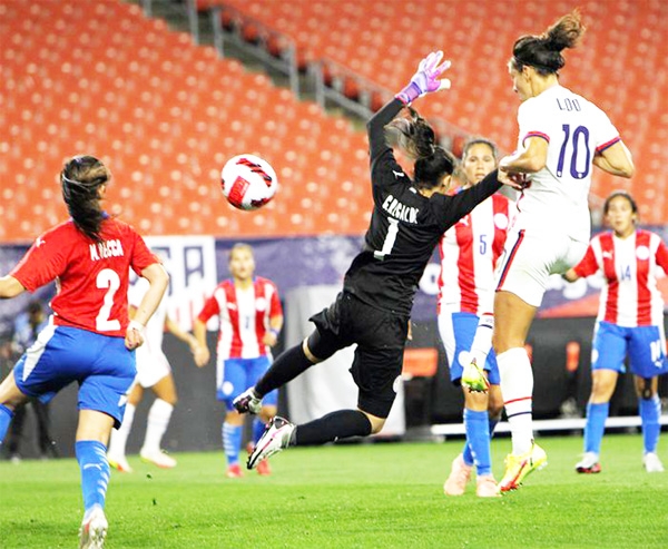 U.S. Forward Carli Lloyd (right) sends her fourth goal of the half into the net past Paraguay GK Cristina Recalde (2nd from right) during first half action in the soccer match between the U.S. Women's National team and Paraguay at FirstEnergy Stadium in