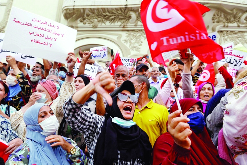 Opponents of Tunisia's President Kais Saied take part in a protest to the streets of Tunis on Saturday.