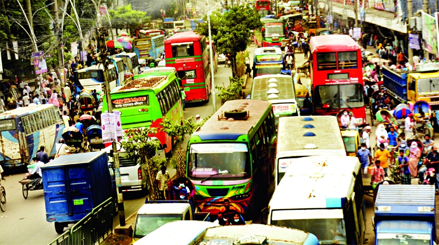 Hundreds of vehicles get clogged at Nayabazar area in the capital on Sunday.