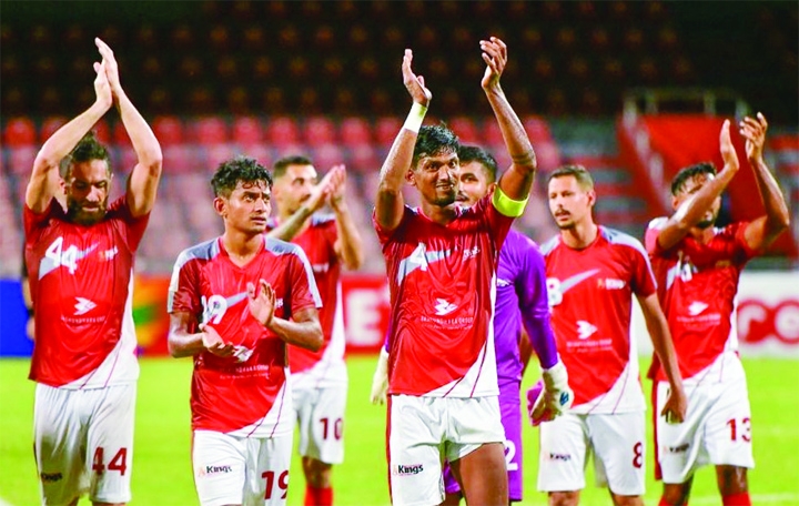 Players of unbeaten champions Bashundhara Kings celebrate after making a 1-1 draw with Dhaka Abahani Limited in their second leg match of the Bangladesh Premier League Football at the Bangabandhu National Stadium on Monday.