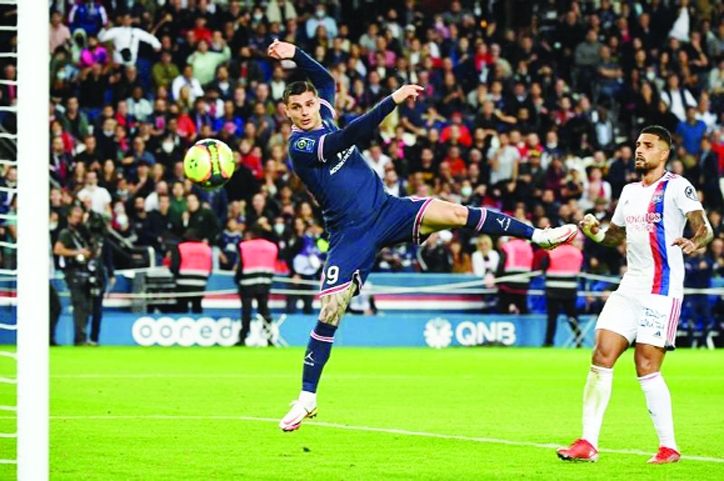 Paris Saint-Germain's forward Mauro Icardi (left) heads to score his team's second goal during the French L1 football match against Olympique Lyonnais at the Parc des Princes Stadium in Paris on Sunday.