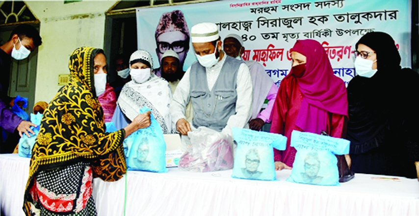 Masks, rice and cash assistance were provided among the distressed people of Bagura Gabtali upazila on the occasion of the 40th death anniversary of former parliament member Shirajul Haque Talukder held on the premises of Azad Manjil Hafizia Madrasha on S