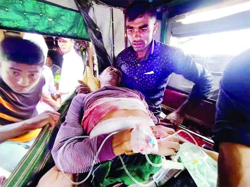 A man is being taken to hospital after being shot in the Kutubjom union parishad (UP) under Maheshkhali upazila on Monday. NN photo