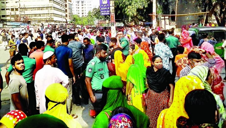 Workers of a readymade garment (RMG) factory stage a demonstration in the capital's Mirpur area on Saturday demanding payment of their arrears. NN photo