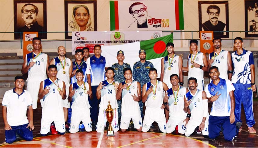 Members of Bangladesh Navy team, the champions of the Bangabandhu Federation Cup Basketball Tournament, pose for a photo session at Dhanmondi basketball gymnasium in the city on Sunday.