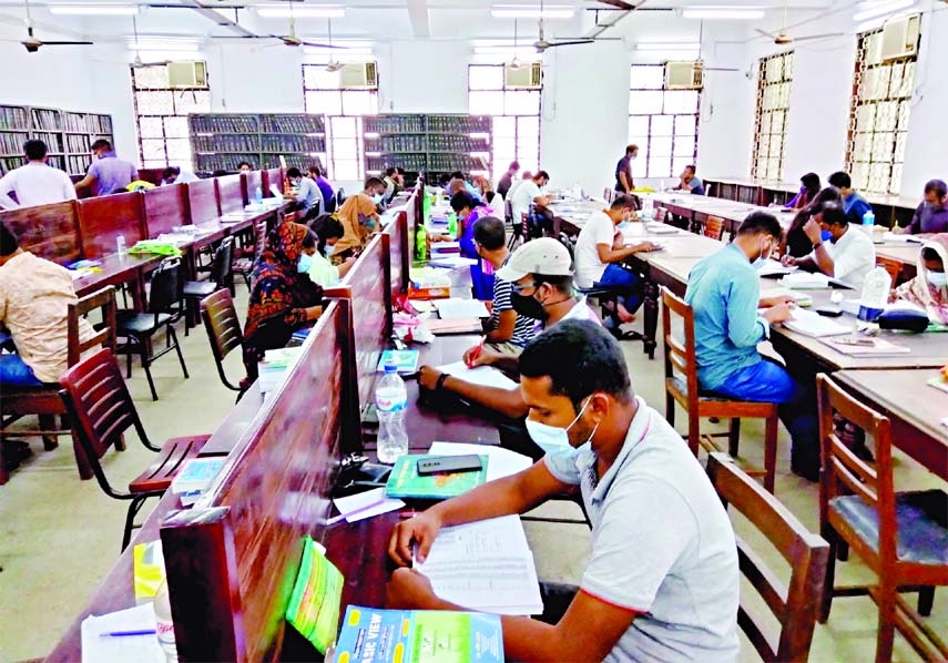 Students back to Dhaka University library following health norms on Sunday as it reopened after a 18-month long closure due to the Covid-19 pandemic.
