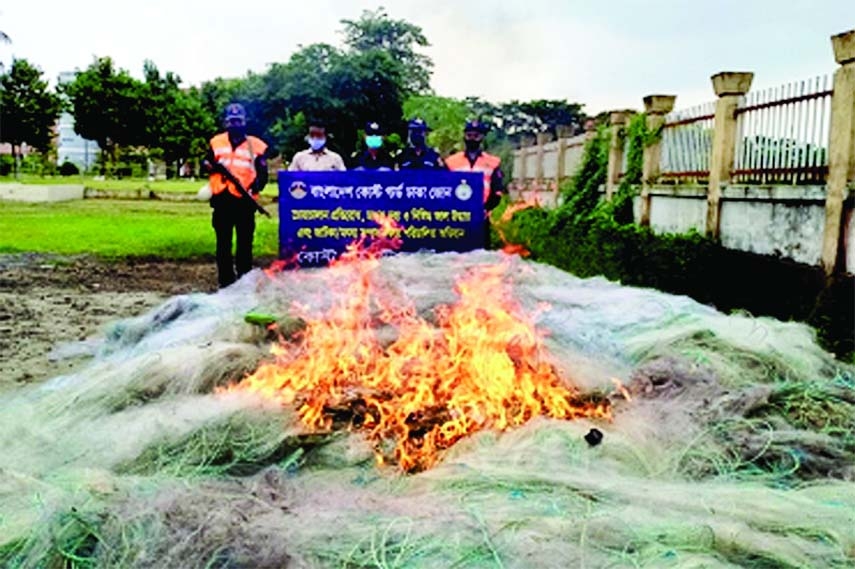 Members of Chandpur Coastguard Station burning huge quantity of banned current nets worth about Tk 6 crores on the premises of Coastguard station. The nets were seized from the Meghna and Padma rivers during their drives on Sunday last. Sadar Upazil