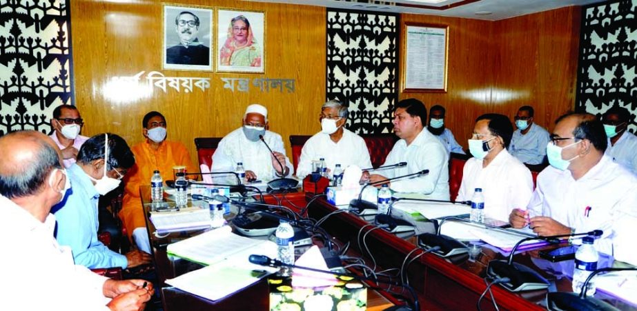 State Minister for Religion Faridul Haque Khan presides over the meeting of Hindu Religious Welfare Trust Board' at the conference room of the ministry on Monday. NN photo