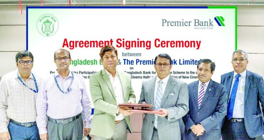 M Reazul Karim, Managing Director & CEO of Premier Bank Limited and Md. Anwarul Islam, General Manager of Bangladesh Bank (BB), exchanging document after signing an agreement at BB head office in the capital on Monday. Under the deal, Premier Bank will