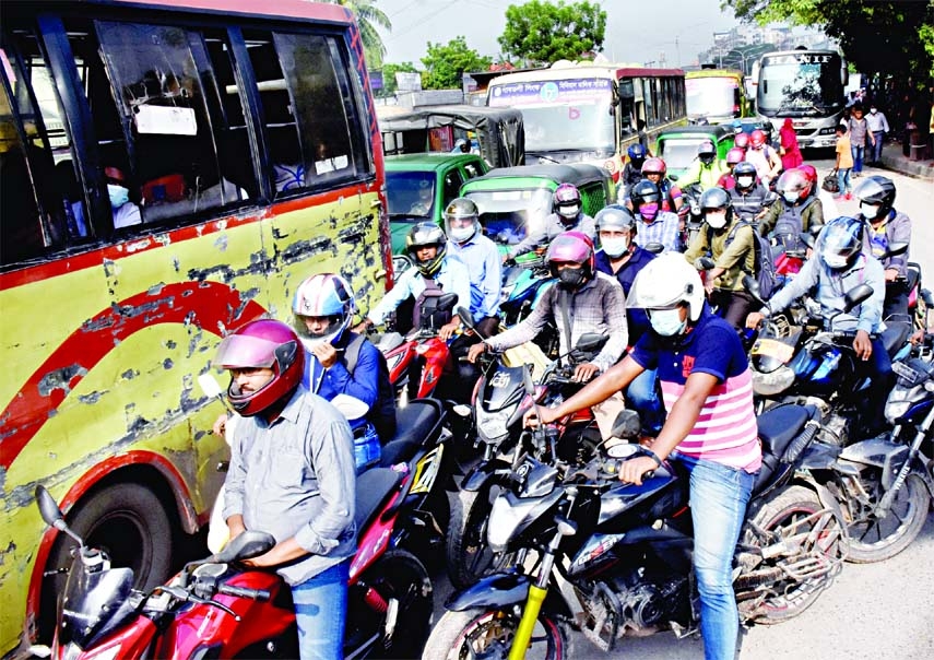 Ride-sharing drivers drive bikes haphazardly. As a result, pedestrians as well as other vehicles face problems frequently on the roads. This photo was taken from near Gabtoli Technical Road in the capital on Monday.