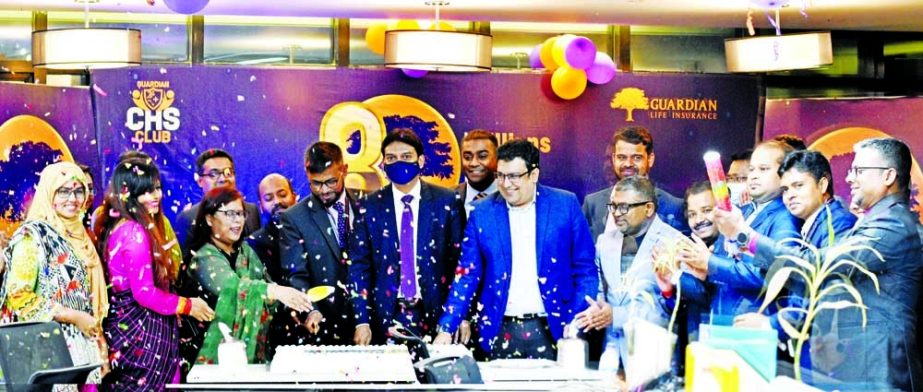 Sheikh Rakibul Karim, CEO (CC) of Guardian Life Insurance Limited, celebrating its 8th anniversary by cutting a cake at its head office in the capital recently with the motto "Millions under the Shade". Top executives of the company were present.