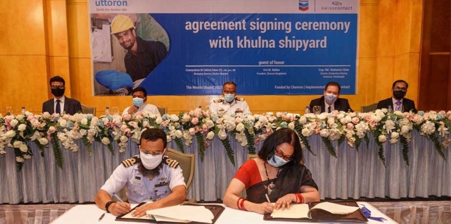 Commodore M. Zakirul Islam, Managing Director of Khulna Shipyard (KSY) and Eric M. Walker, President of Chevron Bangladesh, singing an agreement to introduce internationally standardized advanced welding training for the first time in Bangladesh at a hote