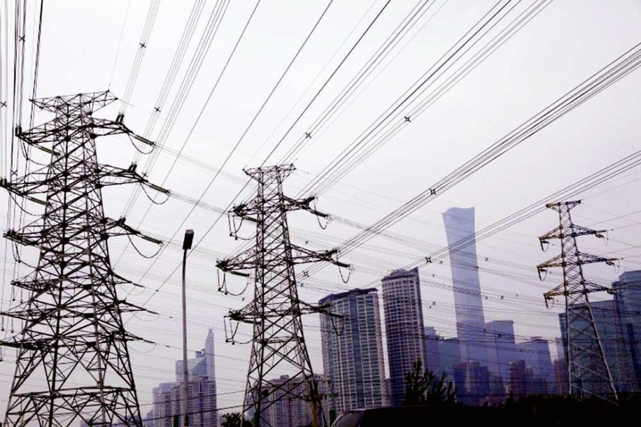 Electricity transmission towers are pictured near Beijing's Central Business District. Agency photo