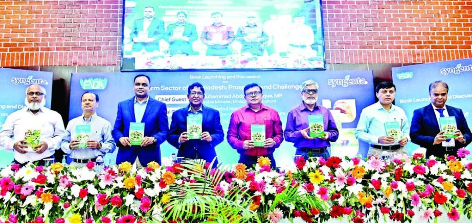 Agriculture Minister Dr. Abdur Razzaque, among others, holds the copies of a book titled' Farm Sector of Bangladesh: Prospects and Challenges' at its cover unwrapping ceremony in BARC auditorium in the city on Wednesday. NN photo