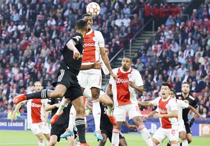 Ajax Amsterdam's midfielder Ryan Gravenberch (right) fights for the ball with Besiktas' midfielder Salih Ucan during their UEFA Champions League Group C football match at The Johan Cruijff ArenA in Amsterdam on Tuesday.