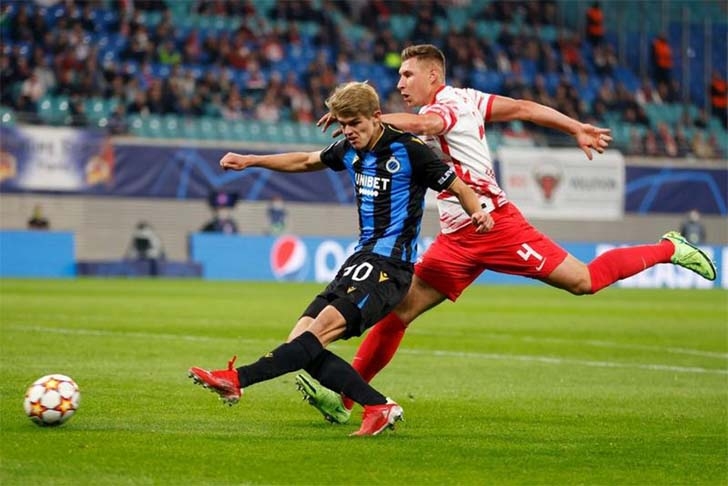 Club Brugge's midfielder Noa Lang gets a shot away in front of Leipzig's defender Willi Orban (right) during the UEFA Champions League Group A football match between RB Leipzig and Club Brugge in Leipzig, eastern Germany on Tuesday.