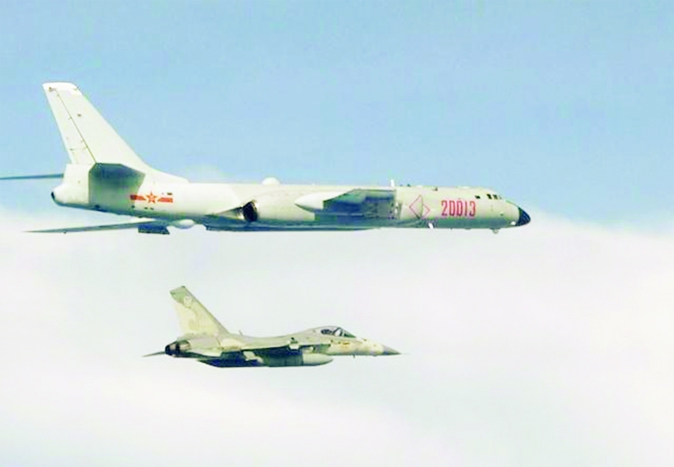 Chinese Air Force planes flying towards Taiwan's defence zone.