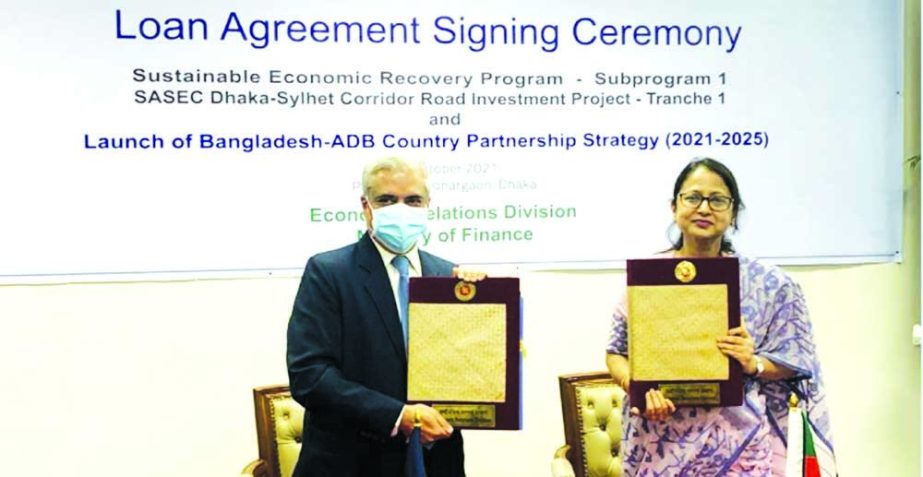 Fatima Yasmin, Secretary of Economic Relations Division (ERD) and Manmohan Parkash, Country Director of Asian Development Bank, exchanging documents after signing a loan agreement at a ceremony in the capital on Monday.