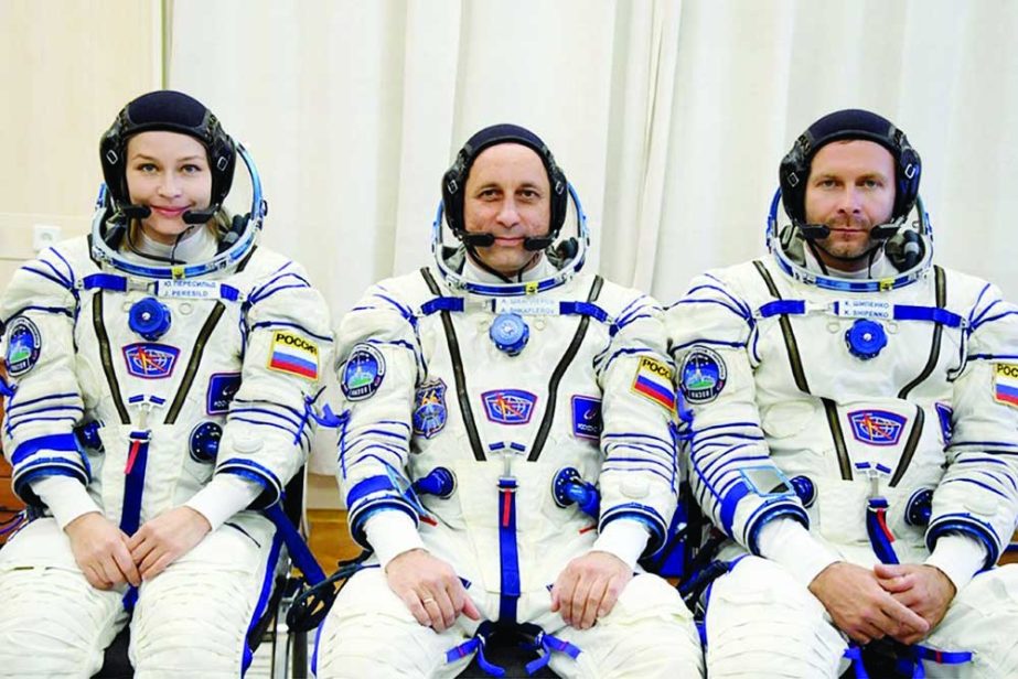 Yulia Peresild, Anton Shkaplerov and Klim Shipenko in their space suits prior to launch. Agency photo