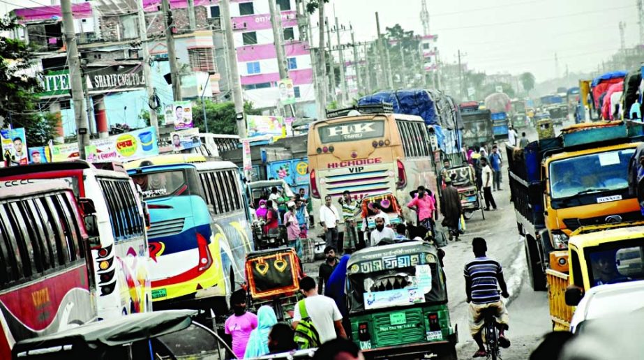Commuters suffer badly due to dilapidated condition of Dhaka-Bogura Highway. This photo was taken on Wednesday. NN photo