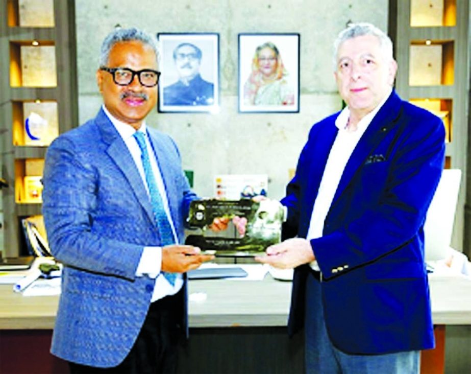 BGMEA President Faruque Hassan handing over a crest to Joao Tabajara de Oliveira Junior, Brazil Ambassador to Bangladesh at BGMEA office on Thursday.