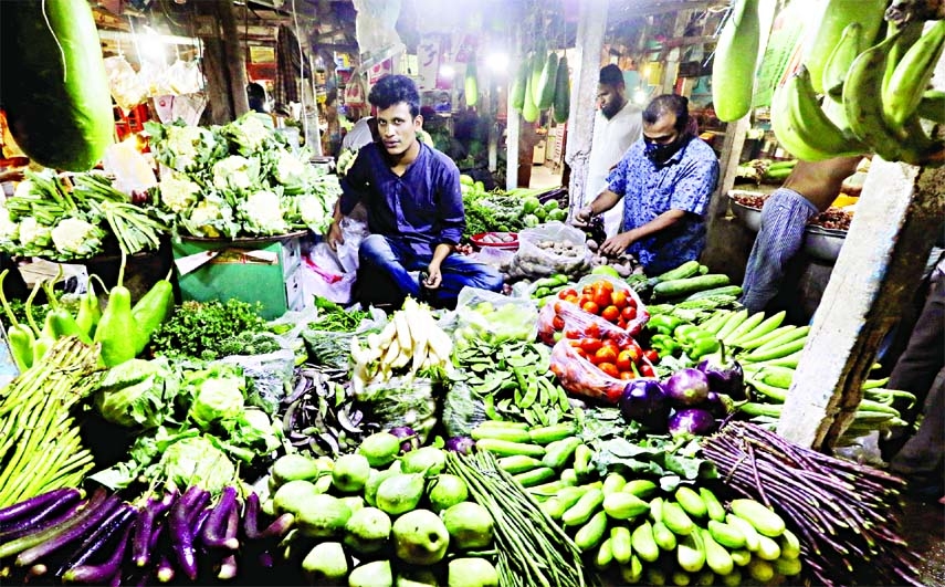 Prices of most vegetables and fishes in the kitchen markets go out of reach of common people. This photo was taken from Karwarn Bazar in the city on Thursday.