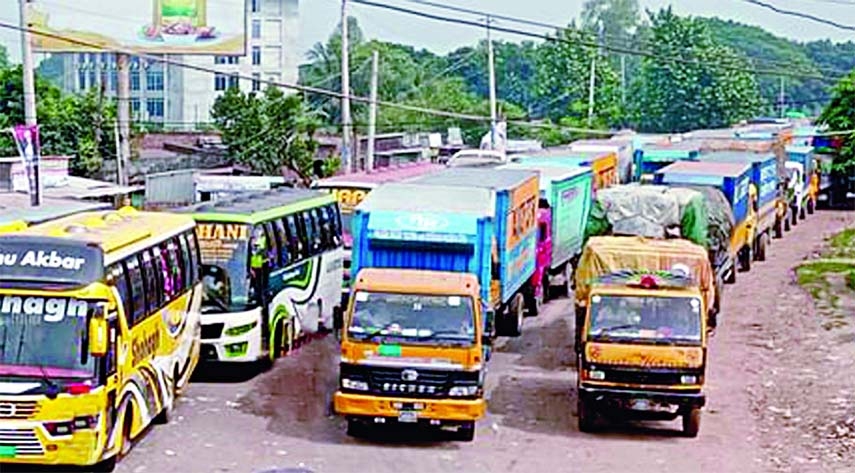 Hundreds of vehicles get stuck in a long tailback at Paturia-Daulatdia ghat in Rajbari district on Friday due to ferry crunch.