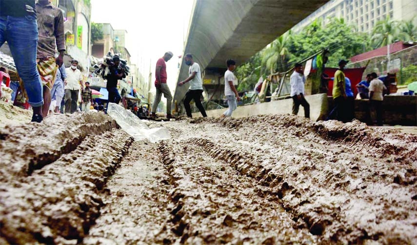 A busy road at Fulbaria in the capital is being dug for repair work causing immense sufferings to commuters and pedestrians in the city. The photo was taken on Friday.