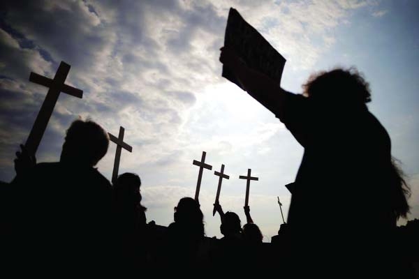 Demonstrators pay tribute to Brazil's 600,000 COVID-19 deaths.