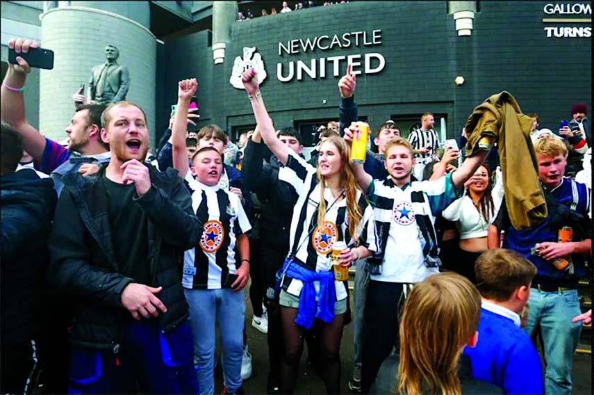 Newcastle United fans celebrate the sale of the club a consortium including Saudi Arabia's Public Investment Fund on Friday.