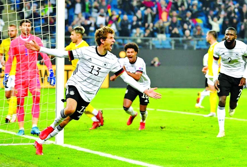 Thomas Mueller (front) of Germany celebrates after scoring during the FIFA World Cup Qatar 2022 European Qualifiers Group J football match between Germany and Romania in Hamburg, Germany on Friday.