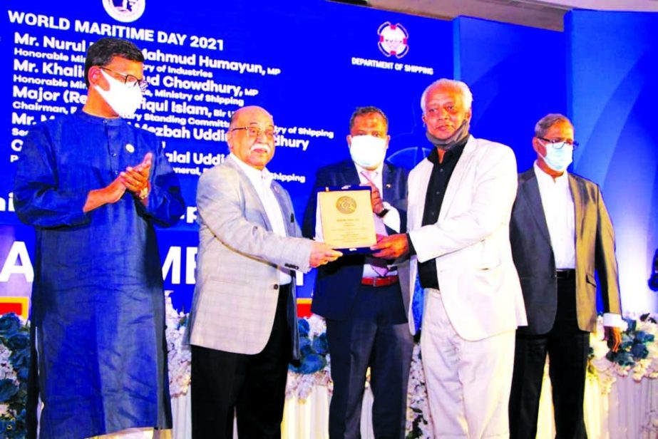 Industries Minister Nurul Majid Mahmud Humayun, MP, handing over the 'Maritime Award' to Mohammad Meherul Karim, CEO of SR Shipping Limited in recognition of its bravery and acquisition at a function held in the capital recently. State Minister for Ship