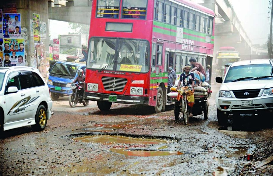 Commuters face tremendous problem due to dilapidated condition of road stretching from Uttara to Gazipur. This photo was taken from Cherag Ali Road on Saturday. NN photo