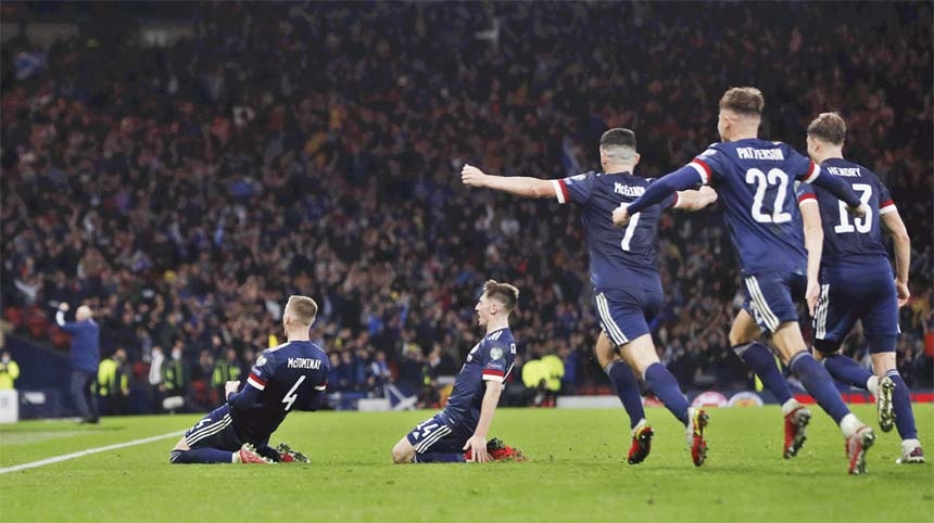 Scotland's McTominay (front) celebrates after scoring their third goal in a 3-2 win over Israel at Hampden Park on Saturday.