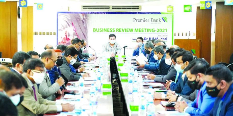 Dr. H.B.M. Iqbal, Chairman, Board of Directors of Premier Bank Limited, presiding over the Business Review Meeting-2021 at the bank's head office in the capital on Saturday. Muhammed Ali, Advisor, M. Reazul Karim, Managing Director & CEO and other execut