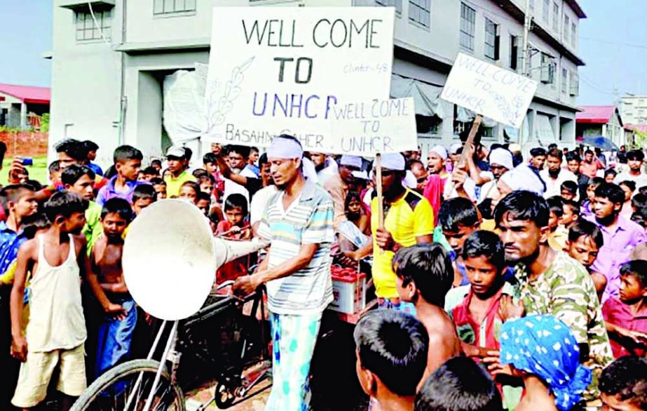 Rohingyas bring out a procession to celebrate the signing of a MoU between the Bangladesh government and the UN on humanitarian services to Rohingyas relocated to Bhasan Char on Sunday. NN photo