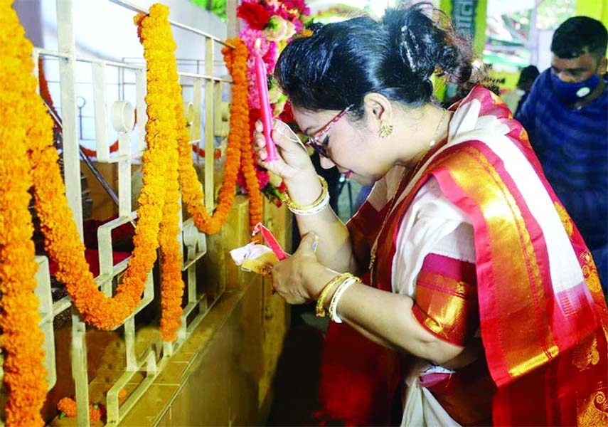 Hindu devotees worship at a temple in the capital on Monday as Durga began with the incarnation (Bodhon).