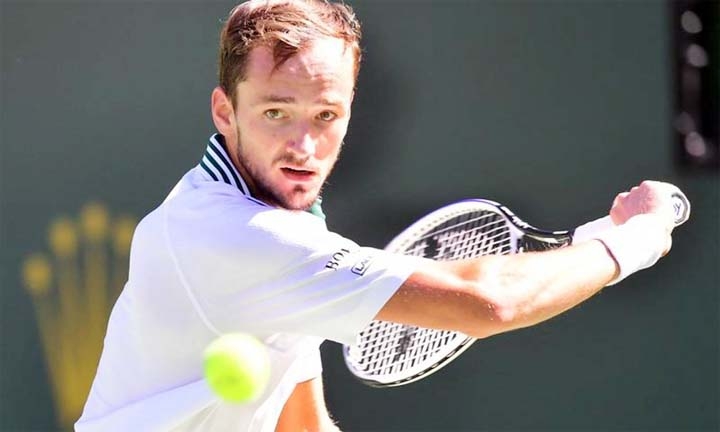 Daniil Medvedev of Russia eyes a backhand return to Grigor Dimitrov of Bulgaria in their Round of 16 match at the Indian Wells tennis tournament in Indian Wells, California on Wednesday.