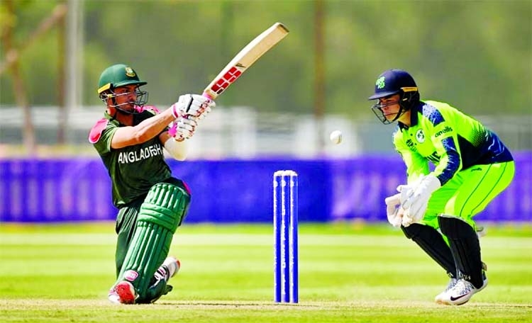 Nurul Hasan Sohan (left) of Bangladesh hits a ball, while wicketkeeper Neil Rock of Ireland looks on during their ICC T20 World Cup warm-up match at Abu Zayed Stadium in Dubai on Thursday.