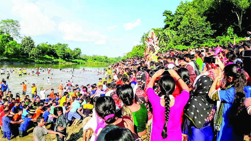 The farewell ceremony of Goddes Durga with the abandonment of her idol into the Feni River was held with tears of thousands of devotees from both sides of the Bangladesh-India border at Ramgarh Anandapara Ghat on the Feni River on Friday.