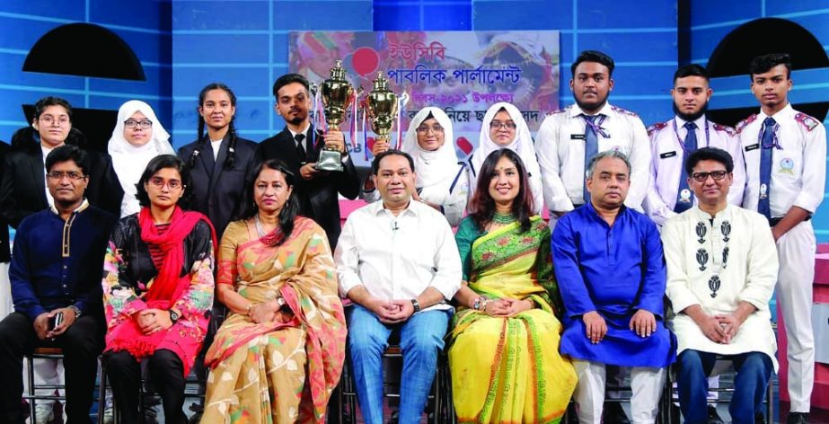 Guest of Shadow Parliament with the reason of child marriage growth Farida Yasmin and Debate for Democracy Hassan Ahamed Chowdhury Kiron are seen with the debating participants of champion and runner up teams with trophies in hand at FDC in Tejgaon on Fri