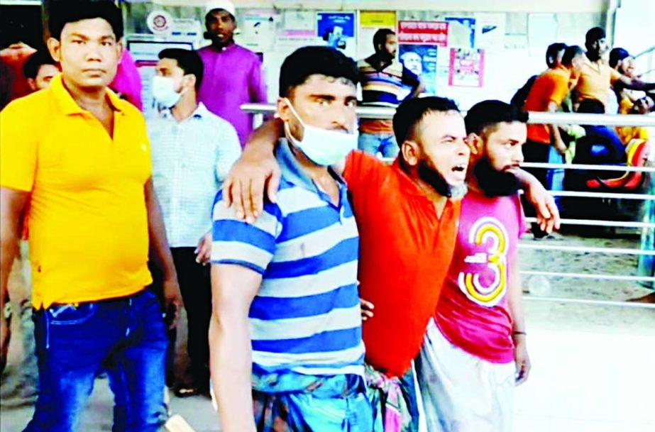An injured person is being taken Magura Sadar Hospital following a clash between supporters of two rival candidates in the Union Parsishad election at Jagodal village in the district on Friday. NN photo