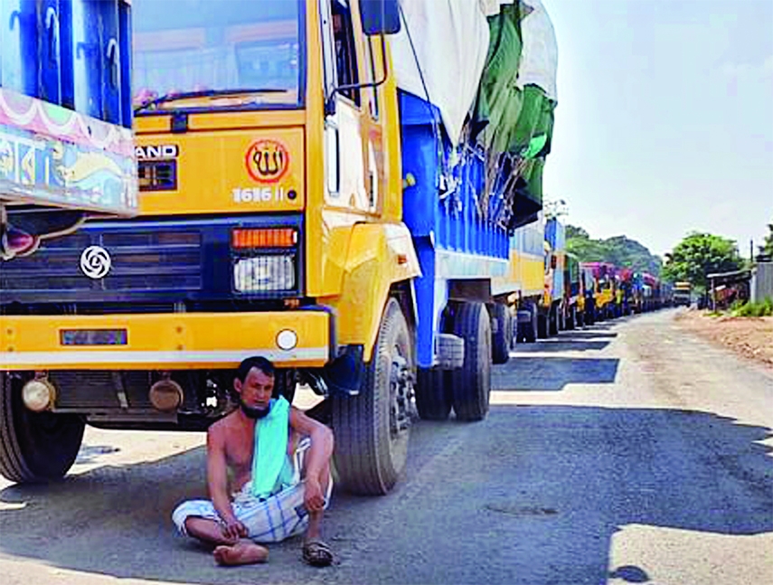 Hundreds of trucks get clogged in long tailback at Daulotdia Ghat in Rajbari on Friday due to ferry crisis.