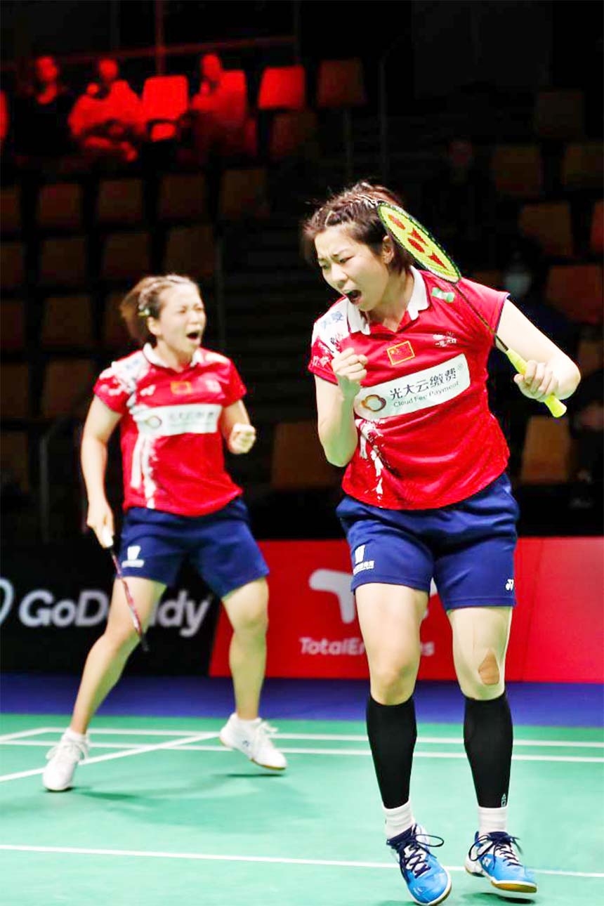 Chen QingchenJia Yifan (right) of China celebrate in the women's doubles match against Rawinda PrajongjaiPuttita Supajirakul of Thailand during a semifinal match between China and Thailand at Uber Cup badminton tournament in Aarhus, Denmark on Friday.