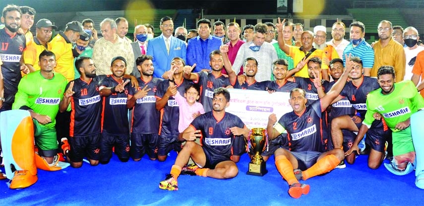 Members of Dhaka Mariners Youngs Club, the champions in the Club Cup Hockey, with the guests and officials of Bangladesh Hockey Federation pose for a photo session at the Maulana Bhashani National Hockey Stadium on Saturday.