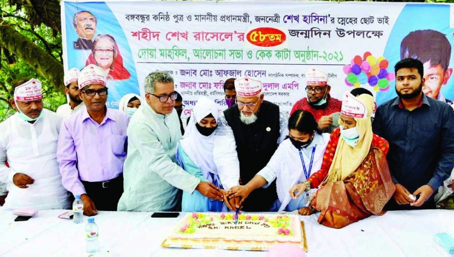 State Minister for Religious Affairs Md Faridul Haq Khan cuts a cake with the children at Dhanmondi 32 No Bangabandhu Memorial Museum on the occasion of the 58th Birthday of Shahid Sheikh Russel. NN photo