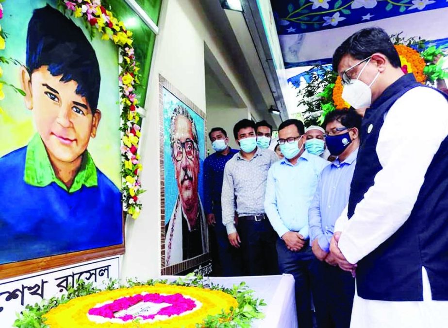 State Minister for Shipping Khalid Mahmud Chowdhury pays floral tributes at the portrait of Sheikh Russel at BIWTC office in the city on Monday organised by Shipping Ministry marking Sheikh Russel Day. NN photo