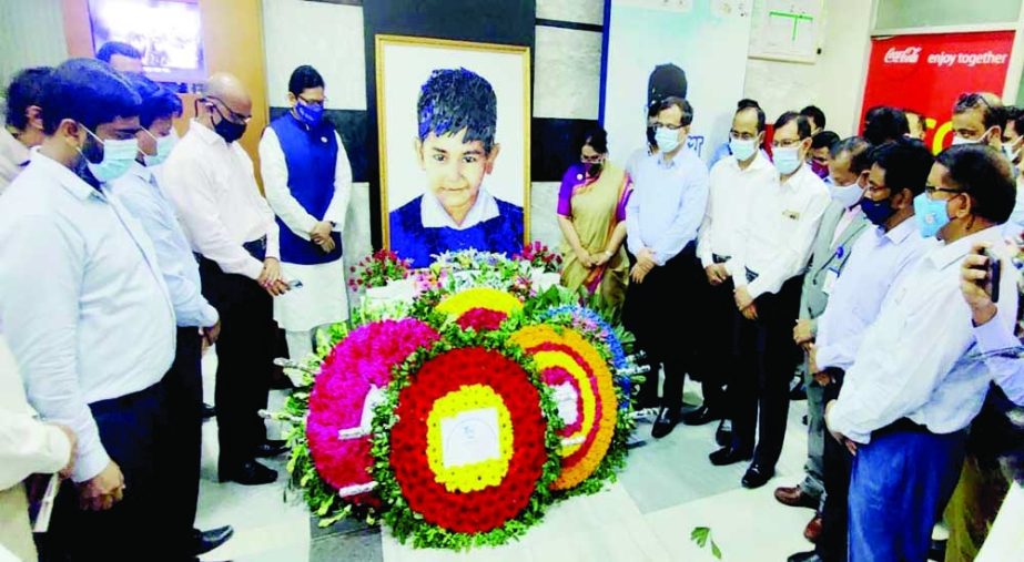 State Minister for ICT Zunaid Ahmed Palak pays floral tributes at the portrait of Sheikh Russel at his office premises on Monday marking Sheikh Russel Day- 2021. NN photo