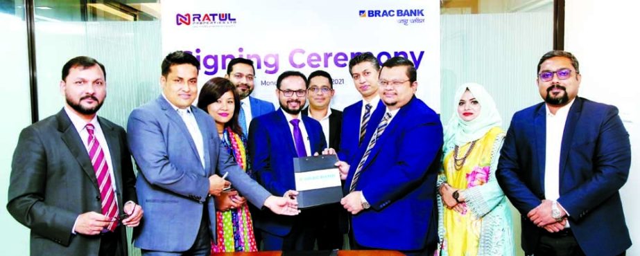 Md. Alinur Rahman, DMD of Ratul Properties and Monirul Islam, Head of Retail Lending of BRAC Bank Limited, exchanging document after signing an agreement at the housing company head office in the capital recently. Senior officials from both sides were pre
